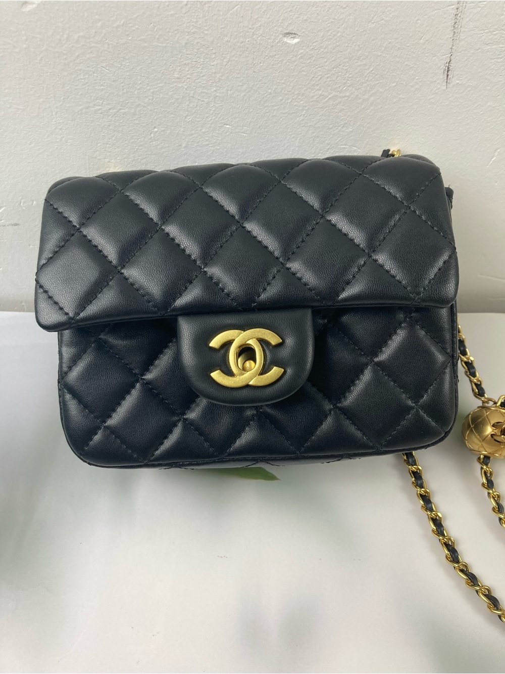 CHANEL Quilted Black Lambskin Mini Crossbody with Gold Hardware
